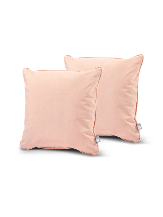Two peach-colored square B Cushion Twin Pack Pastel Collection from Brisks with smooth, splash-proof fabric are placed against a white background. Each pillow has a small white tag on one of the bottom corners. The pillows have a subtle sheen and appear plush and comfortable, perfect for adding elegance to your decor.