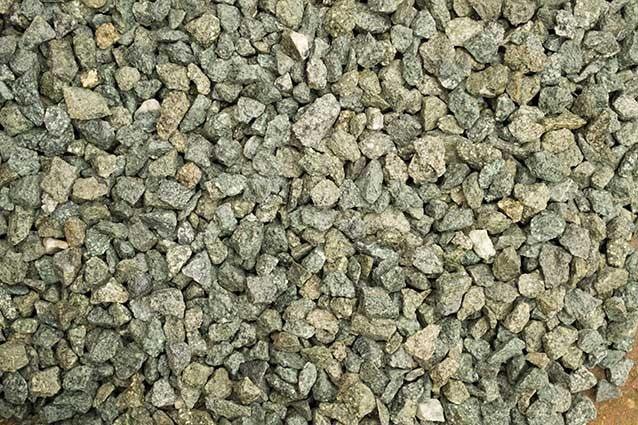 a pile of rocks sitting on top of a sidewalk