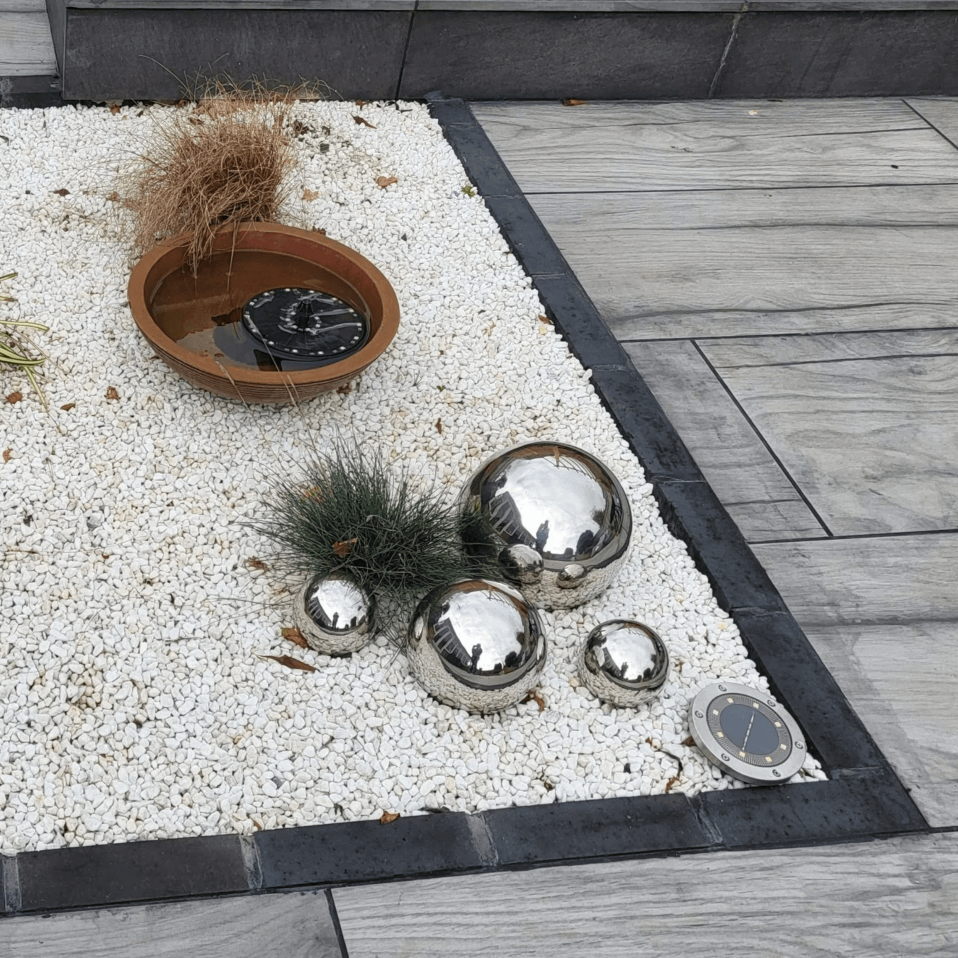 a potted plant sitting on top of a white and black mat
