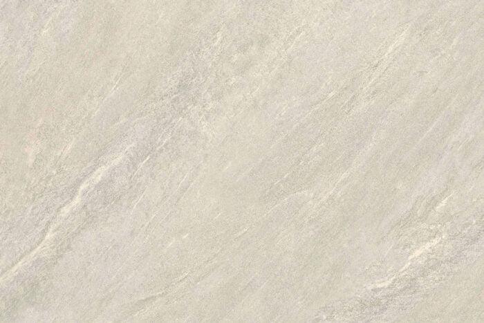 A close-up of Brisks Ultra Aspen Bianco Porcelain Paving Tiles in a light gray stone finish with subtle veining and texture, resembling natural marble or granite. Ideal for outdoor settings, the pattern is mostly uniform with slight variations, giving it a natural and elegant appearance.
