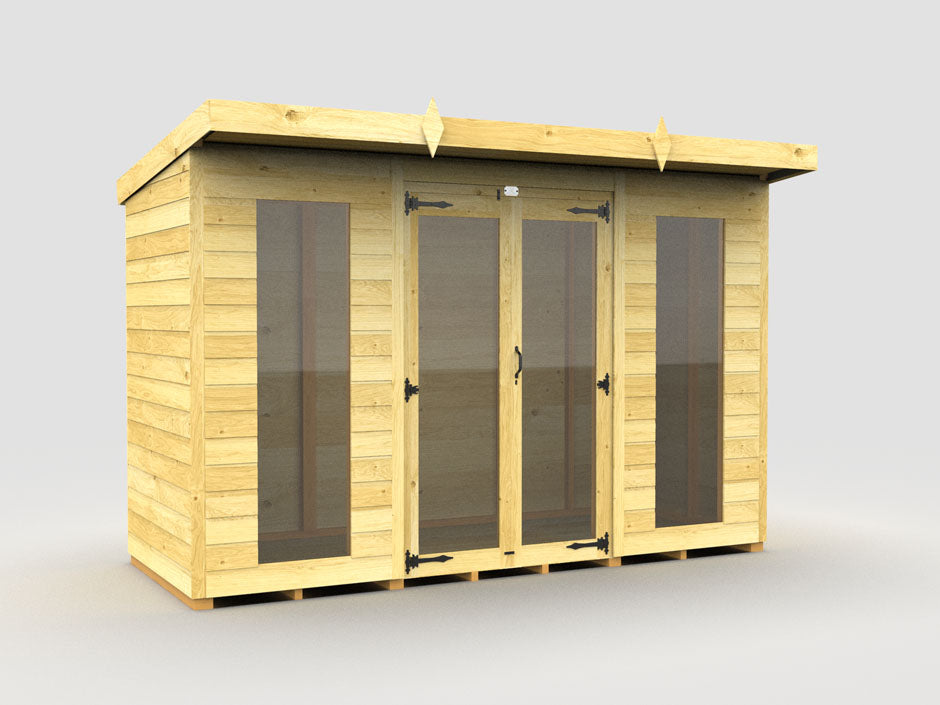 The Pent Summer House by ShedsDIY is a wooden garden shed perfect for optimal storage. It features a flat roof, central door flanked by large glass panels, visible metal hinges, and is weather-resistant. This light brown structure stands elegantly on a gray surface.