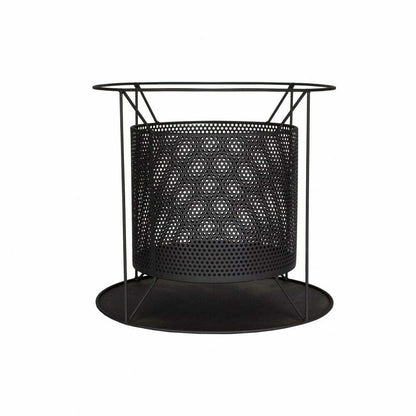 The La Hacienda Kora Fireplace, offered by La Hacienda, is a modern black metal fire pit with a geometric design. Made from durable steel, it features a circular base and a perforated cylindrical center encompassed by a minimalistic frame that showcases its contemporary aesthetic.