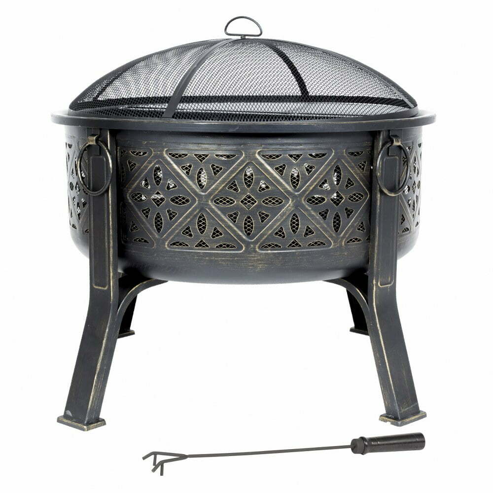 Introducing the La Hacienda Moresque Firepit by La Hacienda: a Moroccan-inspired metal fire pit featuring a mesh cover and intricate cutouts, elegantly supported by four legs. Bringing the essence of North Africa to your space, it includes a poker tool conveniently positioned on the ground before it.