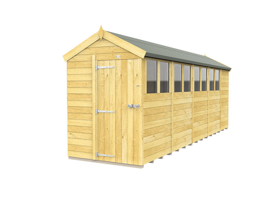 The Apex Shed 5ft Wide by ShedsDIY is a long wooden garden shed with a green gabled roof and tongue and groove construction. It features a single door with metal hinges, several side windows, and a light brown finish that highlights the natural wood quality.