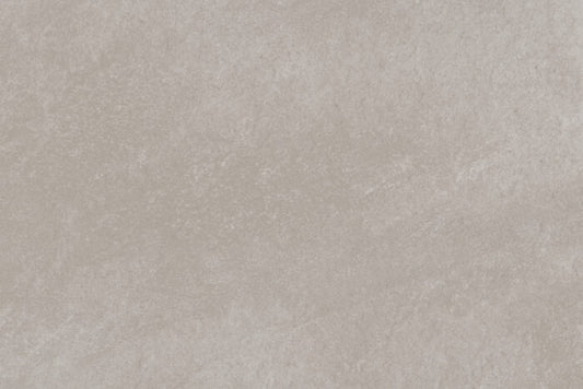 A close-up of a textured surface featuring a blend of light beige and gray tones, resembling stone or concrete. Similar to Brisks' Ancient Grey Porcelain Paving, the pattern is uneven with subtle variations in color and texture—ideal for contemporary design needs.