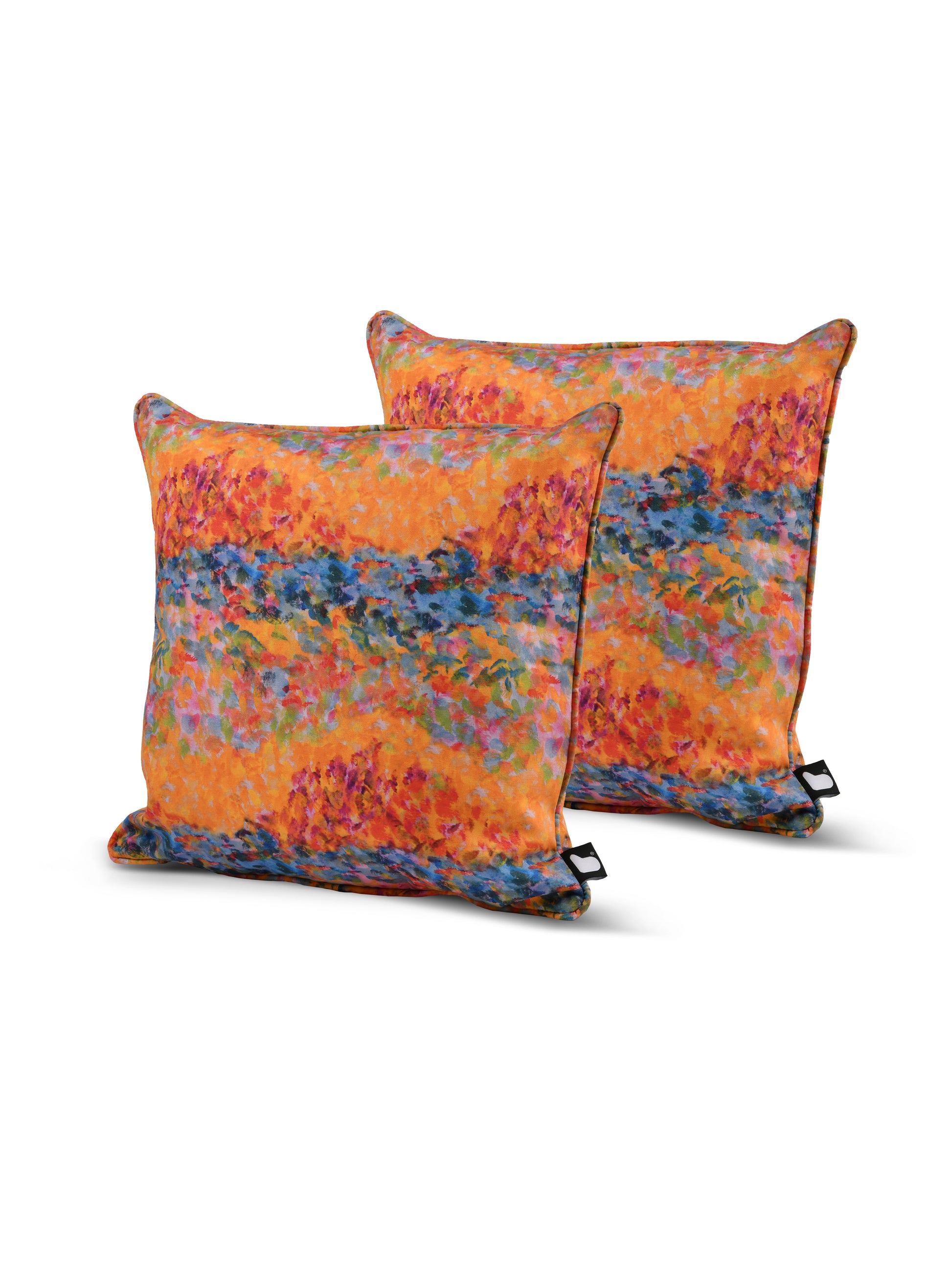 Two square B Cushion Twin Pack Art Collection by Brisks feature a vibrant, abstract design with splashes of orange, blue, and pink. The pattern evokes a painterly style, reminiscent of an impressionistic landscape or sunset. Made with UV resistant and splash-proof fabric, the pillows boast a tag on one corner.