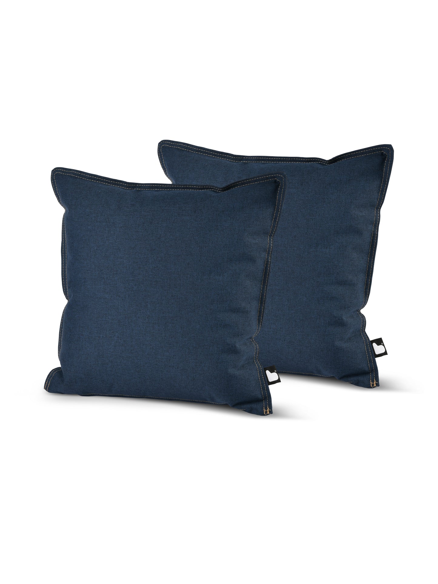 Two square, dark blue pillows with slightly curved corners are displayed against a white background. The Brisks B Cushion Twin Pack Denim Collection boasts UV-resistant and splash-proof fabric. They feature a visible black seam along the edges and a small fabric tag on each, indicating brand or product information.