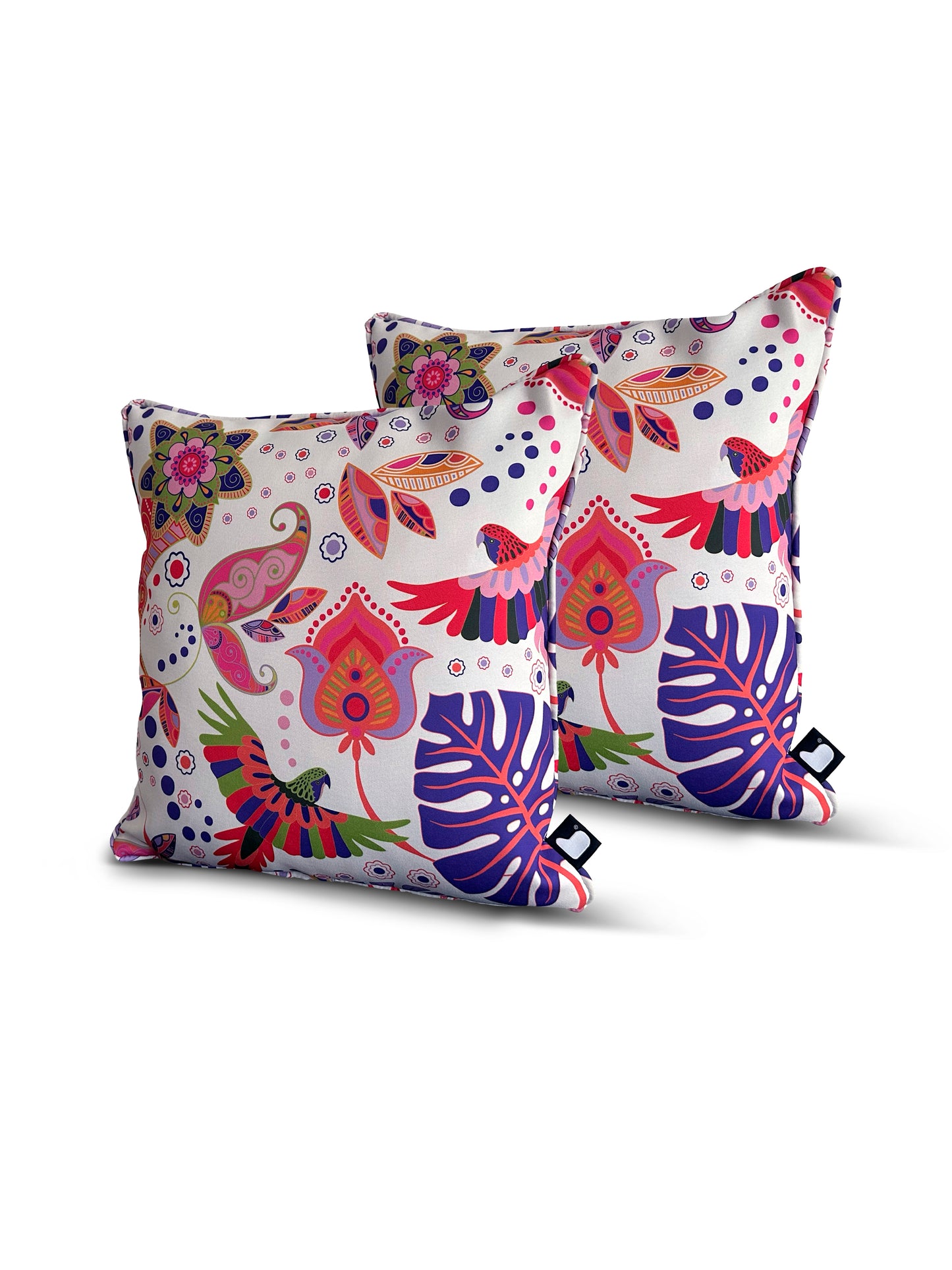 Two square B Cushion Twin Pack Art Collection by Brisks with colorful and vibrant floral patterns featuring pink, red, purple, and green designs on a white background. The splash-proof fabric showcases flowers, leaves, and abstract shapes. These UV-resistant pillows are set against a plain white backdrop.