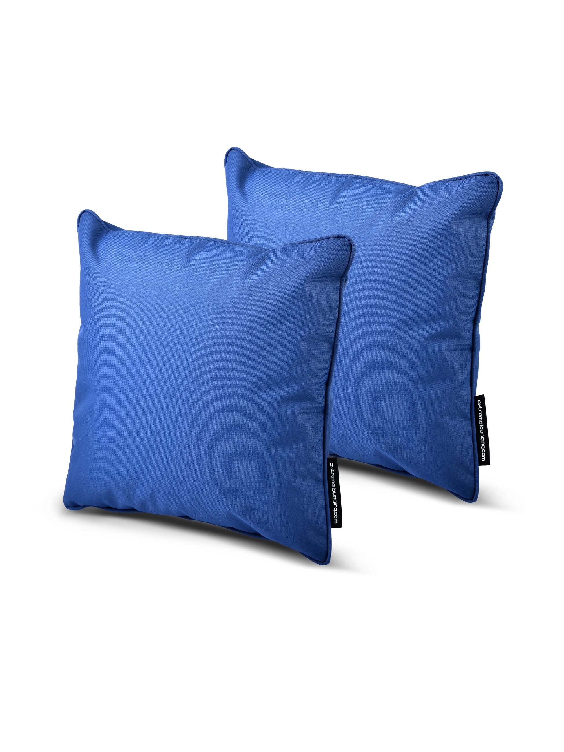 Two blue rectangular pillows with a smooth texture are shown in the image. Both B Cushion Twin Pack Brights Collection cushions from Brisks, made of breathable polyester, have tags on their sides, possibly indicating the brand or care instructions. The splash-proof B Cushion Twin Pack Brights Collection cushions are slightly overlapping, with one positioned just behind the other.