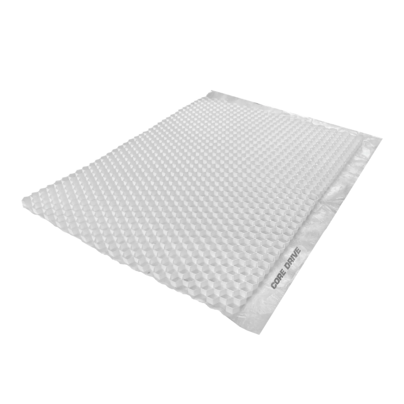 A light gray, rectangular bubble mailer with a textured surface is seen at an angle, reminiscent of porous geotextile. A strip on the side is labeled "CORE DRIVE 40-30 / 40-40 - Gravel Grid" from Core LP.