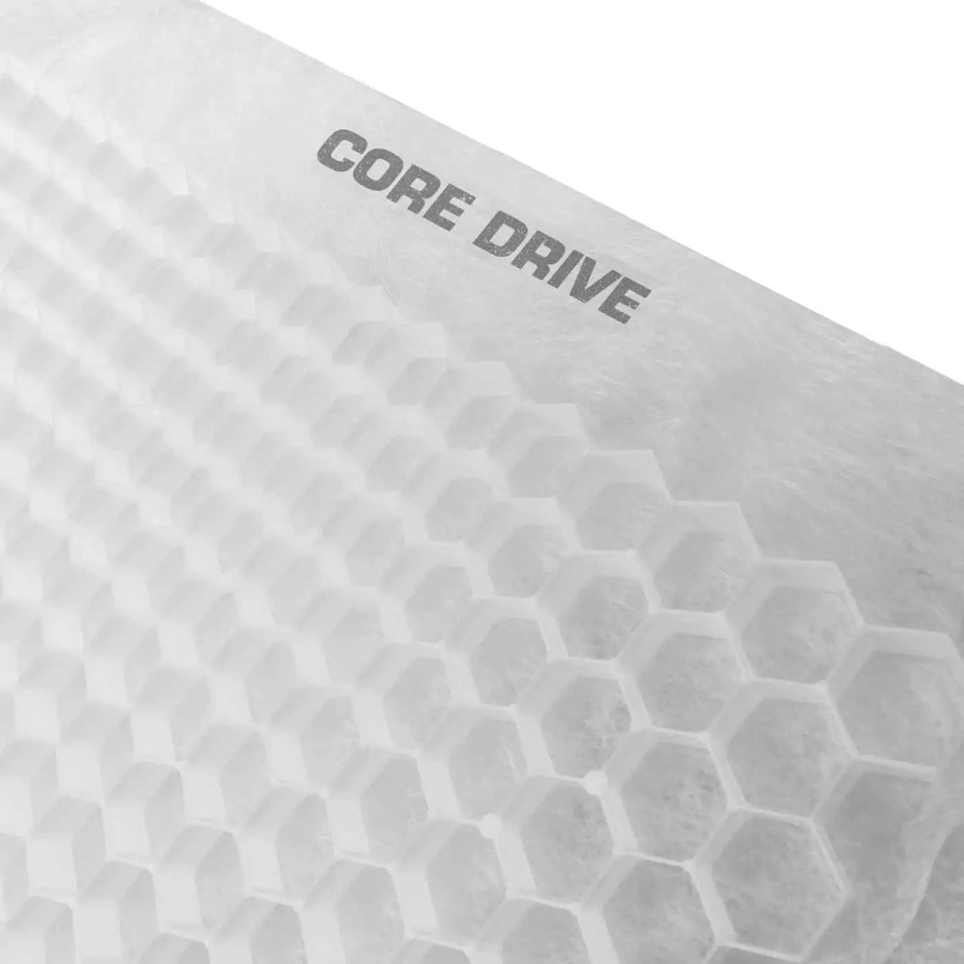 Close-up of a white honeycomb-patterned surface resembling porous geotextile, with "CORE DRIVE" printed on it, part of the Core LP CORE DRIVE 40-30 / 40-40 Gravel Grid.