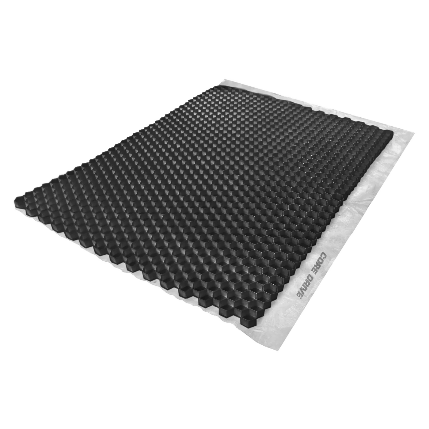 The CORE DRIVE 40-30 / 40-40 Gravel Grid by Core LP features a black honeycomb structure for gravel stabilization, resting on a flat white surface. Its hexagonal cells create a textured, eco-friendly appearance when viewed from an angle.