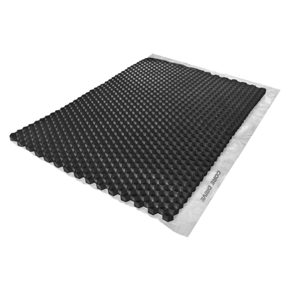 The CORE DRIVE 40-30 / 40-40 Gravel Grid by Core LP features a black honeycomb structure for gravel stabilization, resting on a flat white surface. Its hexagonal cells create a textured, eco-friendly appearance when viewed from an angle.