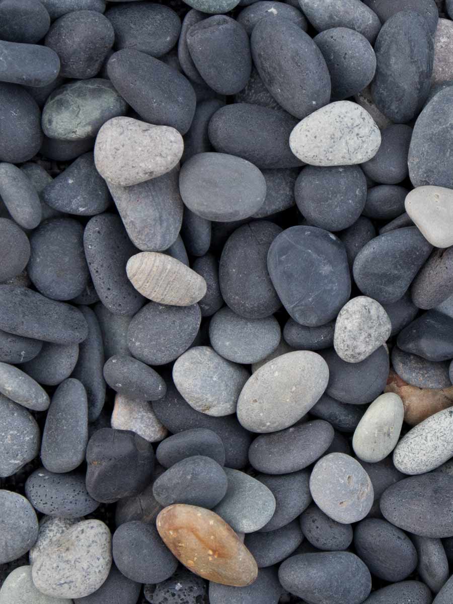 Brisks' 20-40mm Dusk Pebbles, available in gray, black, and beige shades, create a textured surface with natural patterns and subtle variations. Ideal for enhancing charm and elegance in any landscaping project.