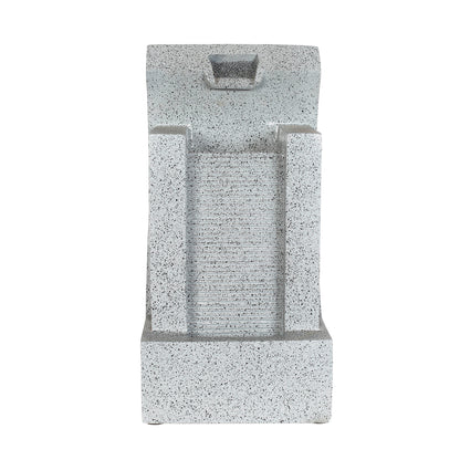 The La Hacienda Kiso Column Water Feature enhances your garden environment with its speckled grey stone tabletop design. Water flows gracefully down a textured panel between two vertical columns, collected in the bottom basin, and illuminated by subtle LED lights for a serene ambiance.