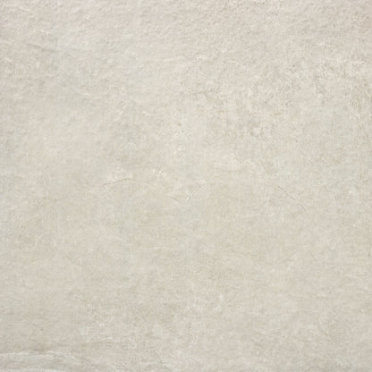 A close-up image of a smooth, light grey stone surface with subtle texture and faint veining. The slightly uneven appearance and natural variations in color and shading give it the look of elegant Priorat Bone Porcelain Paving - Individual Tiles by Brisks, ideal for creating slip-resistant outdoor spaces.