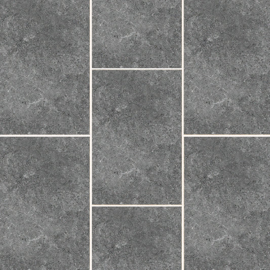A textured gray tile pattern with pale grout lines. The Carmen Anthracite Porcelain Paving Slabs from Brisks are arranged in a staggered fashion with varied rectangular and square shapes, creating a uniform yet visually engaging surface. The sleek finish has a slight mottled appearance, adding depth to the Brisks Carmen Anthracite tones.