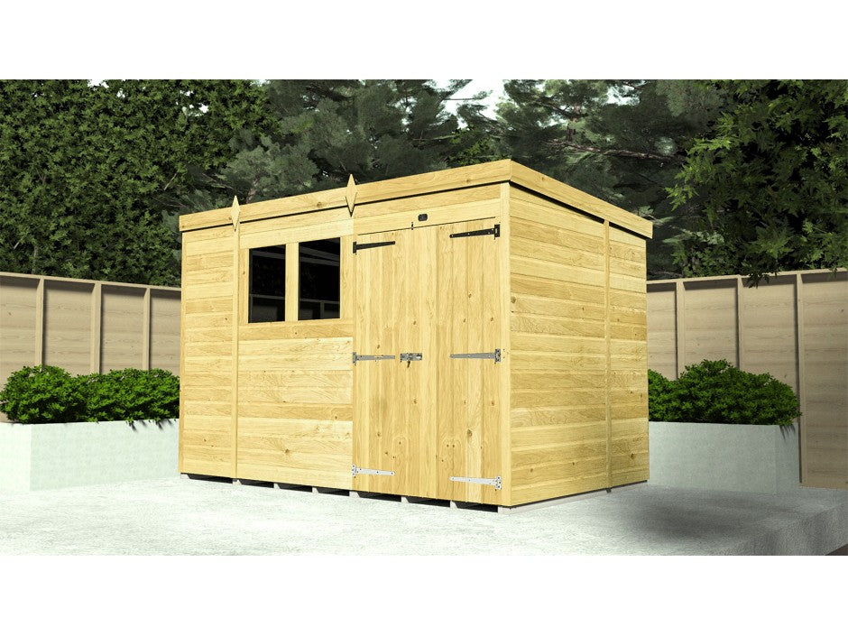 The ShedsDIY Pent Shed 7ft wide, with tongue and groove cladding, is set on a concrete slab. It has a closed door and window, encircled by a wooden fence and lush bushes, with tall trees in the background.