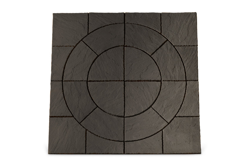 The Welsh Slate Chalice Circle kit by Bowland Stone, available from Brisks, features dark square tiles with 16 smaller square tiles creating a circular pattern at the center. Displayed against a white background, its central design includes four concentric circles intersected by straight lines, offering a geometric aesthetic similar to the Bowland Stone Chalice circle.