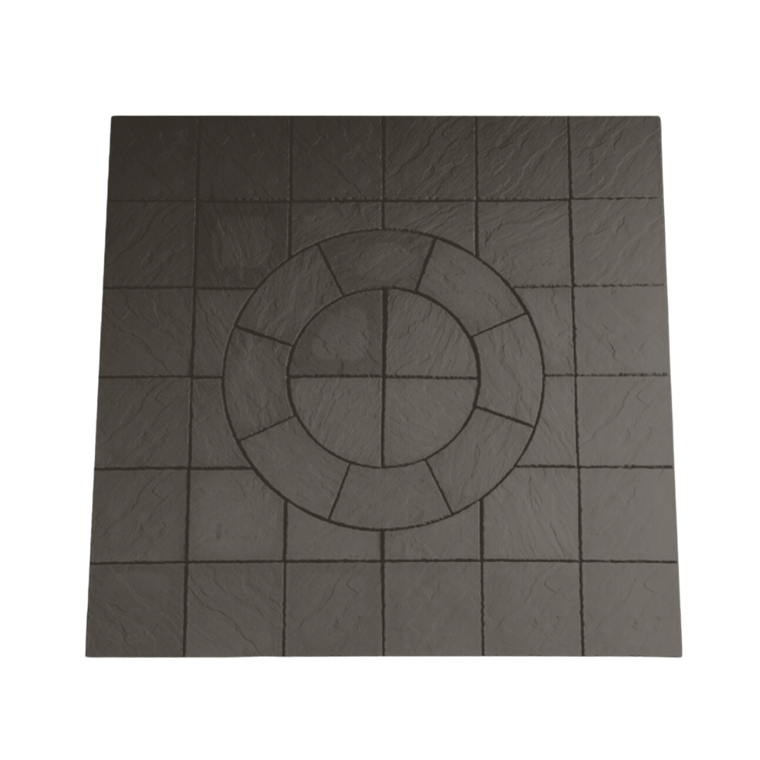 The Welsh Slate Chalice Circle kit by Bowland Stone, offered by Brisks, is a square tile with a textured surface. It features an arrangement of smaller squares around a central circular pattern, creating a visually appealing geometric mosaic. The dark color of the material adds depth and sophistication to its design.