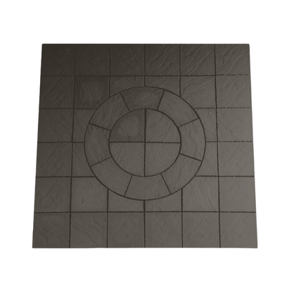 The Welsh Slate Chalice Circle kit by Bowland Stone, offered by Brisks, is a square tile with a textured surface. It features an arrangement of smaller squares around a central circular pattern, creating a visually appealing geometric mosaic. The dark color of the material adds depth and sophistication to its design.