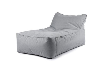 A large, light gray bean bag chair with a slanted backrest sits against a plain white background. The Brisks Extreme Lounging B-Bed Pastel has a rectangular shape with rounded edges, offering a plush and comfortable appearance, perfect for your garden retreat.