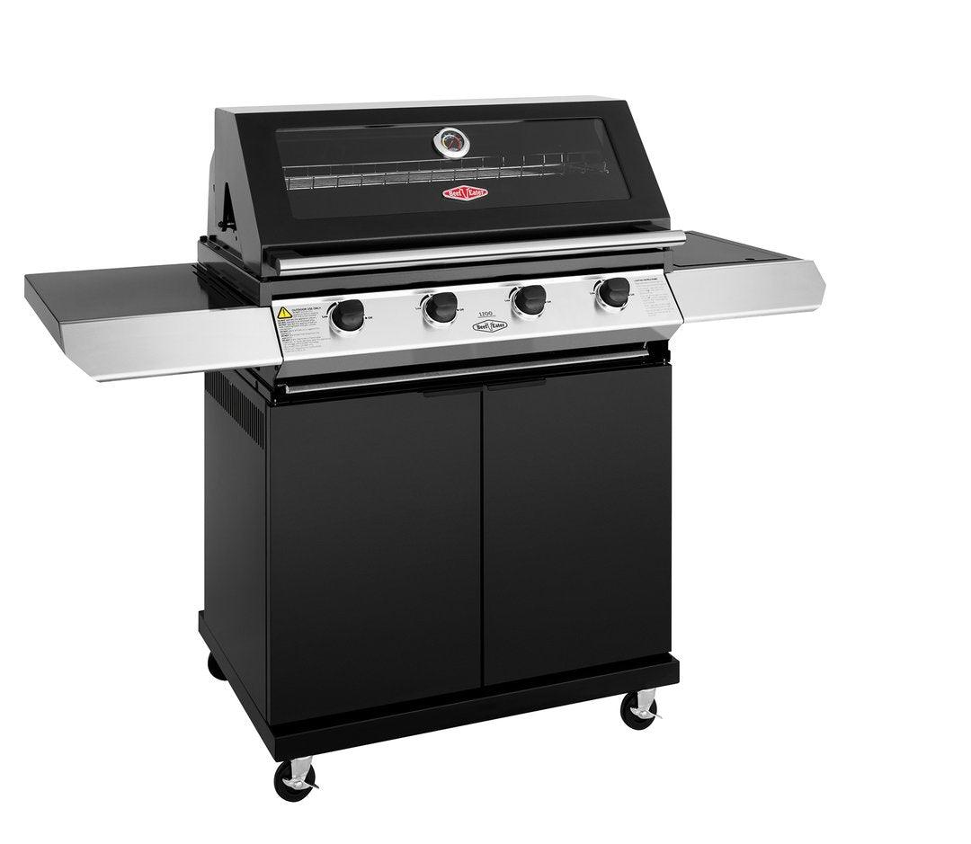 A black and silver Brisks BeefEater 1200E Series 4 Burner BBQ & Trolley with four knobs, a thermometer on the lid, two side shelves, and a two-door lower cabinet. It is mounted on four wheels and boasts a sleek, modern design—ideal for any Outdoor Kitchen.