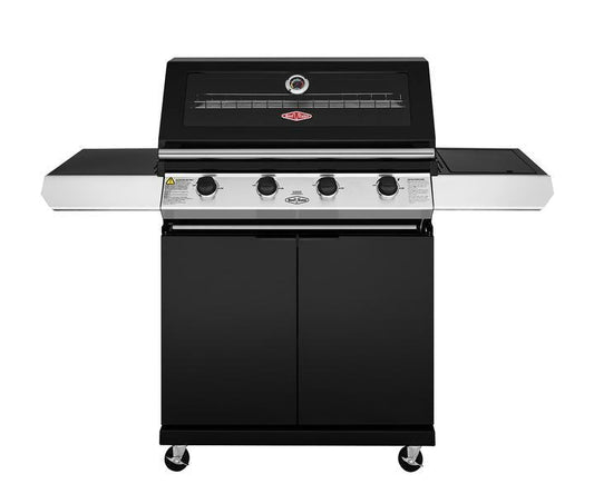 A black and stainless steel Brisks BeefEater 1200E Series 4 Burner BBQ & Trolley with three control knobs. The grill features a compact storage cabinet below and side shelves on each side. A temperature gauge is centered on the lid. The grill, ideal for a complete outdoor kitchen, is set on four wheels for easy mobility.