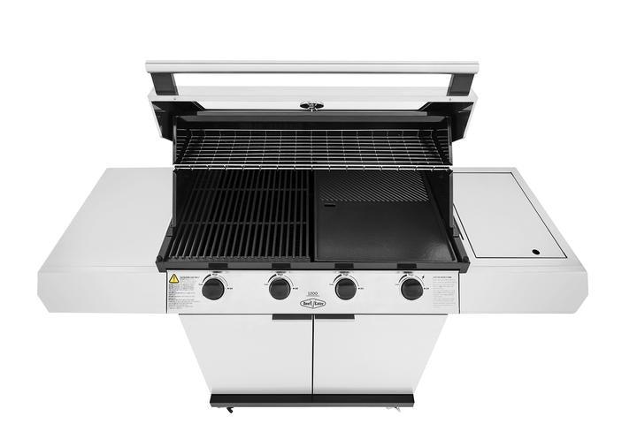 A Brisks BeefEater 1200S Series 4 Burner BBQ & Trolley with an open lid reveals three grilling sections: two with metal grates and one with a flat griddle plate. Perfect for BBQ enthusiasts, it features four control knobs on the front panel, side shelves on both ends, and boasts modern appeal for any outdoor living space.