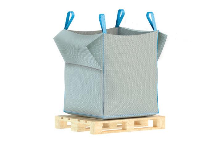 A large, rectangular grey Brisks Empty Bulk Bag made from durable woven polypropylene, with blue lifting loops at each corner, sits on a wooden pallet. The empty bag appears ready for use and suggests a sustainable, reusable option for various needs.