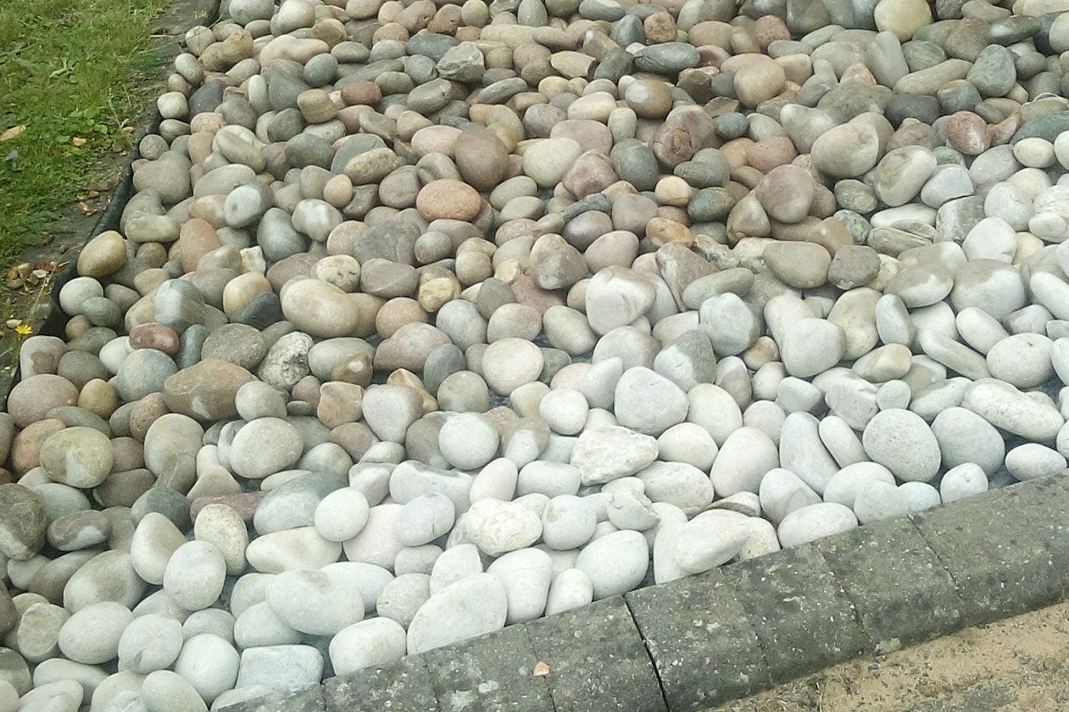 a pile of rocks sitting on the side of a road