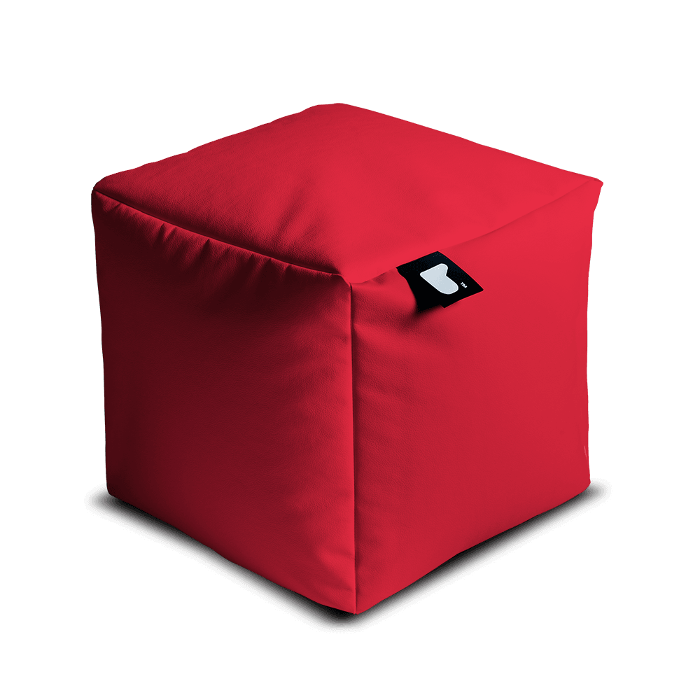 A bright red, fabric-covered cube bean bag filled with polystyrene beads, featuring slightly rounded edges and a small black tag attached to one corner. The tag showcases a white design. This Brisks Extreme Lounging Outdoor B-Box is set against a plain, light grey background, perfect for any garden retreat.