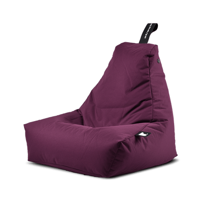 A purple, high-back, L-shaped bean bag chair with a black handle at the top for easy transport. The Brisks Extreme Lounging Outdoor Mini B-Bag features a soft, cushioned surface and is designed for durable and comfortable seating with premium quality fabric.