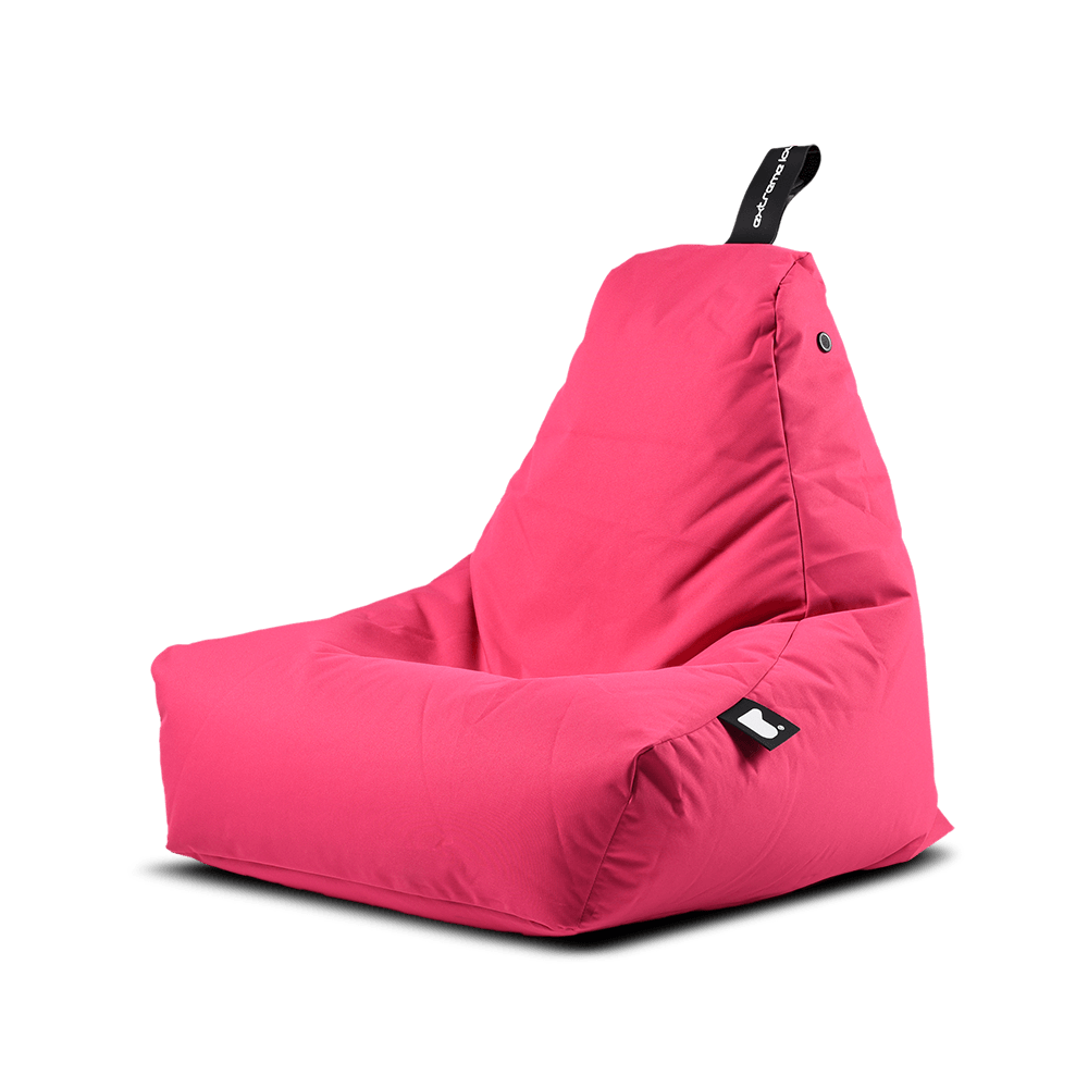 A bright pink Extreme Lounging Outdoor Mini B-Bag by Brisks with a triangular, supportive backrest. It features a black handle at the top, likely for easy carrying, and a small black tag with white stitching on one side. The premium-quality fabric appears to be durable and comfortable for lounging.