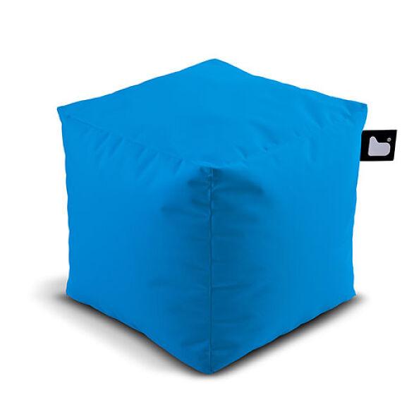A bright blue cube-shaped bean bag, perfect for your garden retreat, with a small black tag featuring a heart on one corner. This Brisks Extreme Lounging Outdoor B-Box has a minimalist design and appears to be made from durable fabric filled with polystyrene beads.
